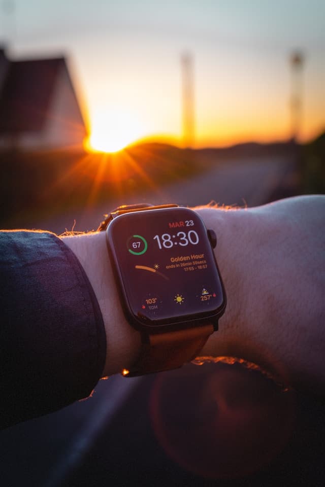 Runner reviewing statistics on a sports watch